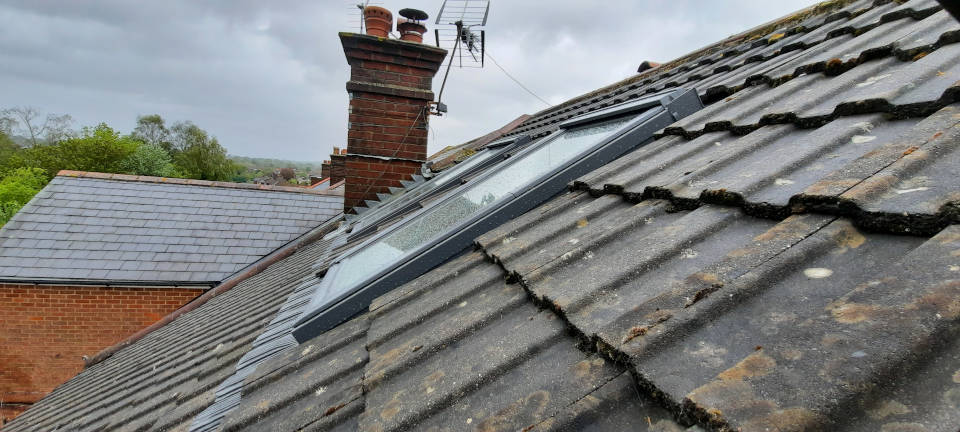 image shows: Installation of a dozen VELUX roof windows