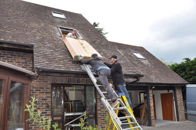 image shows: Installation of a dozen VELUX roof windows